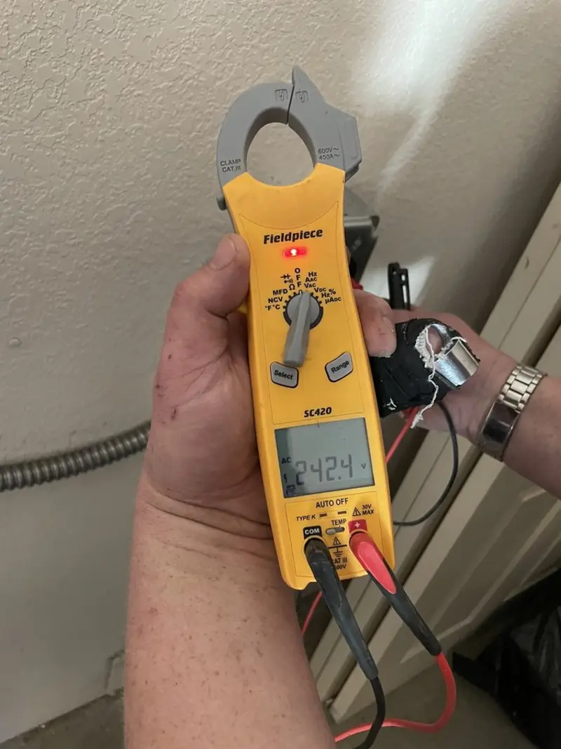 Voltage testing with clamp meter during Ceiling Fan Installation in Jerome